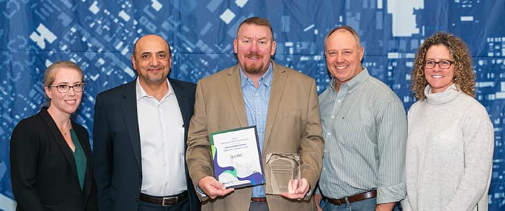 UDC accepts Esri Innovation Award at GeoConX 2019