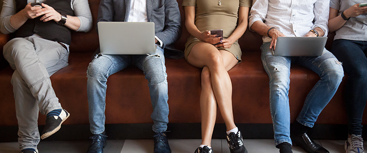 Individuals using and viewing their electronic devices in public