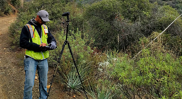 Field Tech recording inspection on mobile tablet Using mobile devices in the field