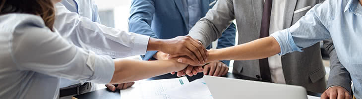 team collaboration concept with stacked hands