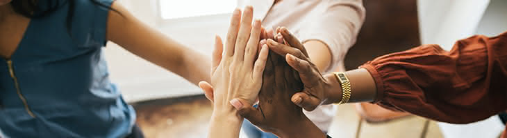 Team collaboration concept with group high-five