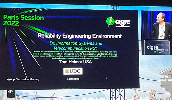 Executive Solution Architect for UDC, Tom Helmer, presents at the CIGRE Session 2022 in Paris.