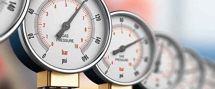 Row of industrial high pressure gas gauge meters